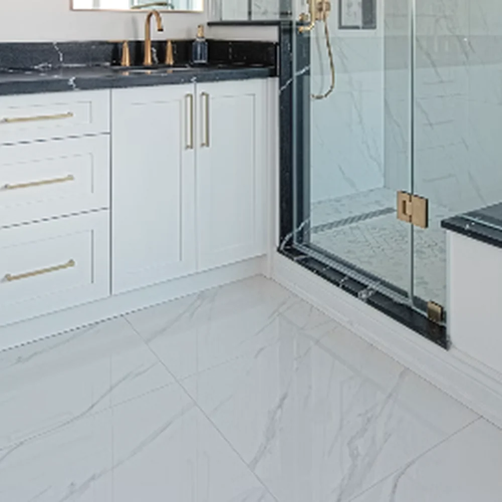 GROHE wall mounted bath mixer with tub spout filling freestanding bathtub in luxury bathroom